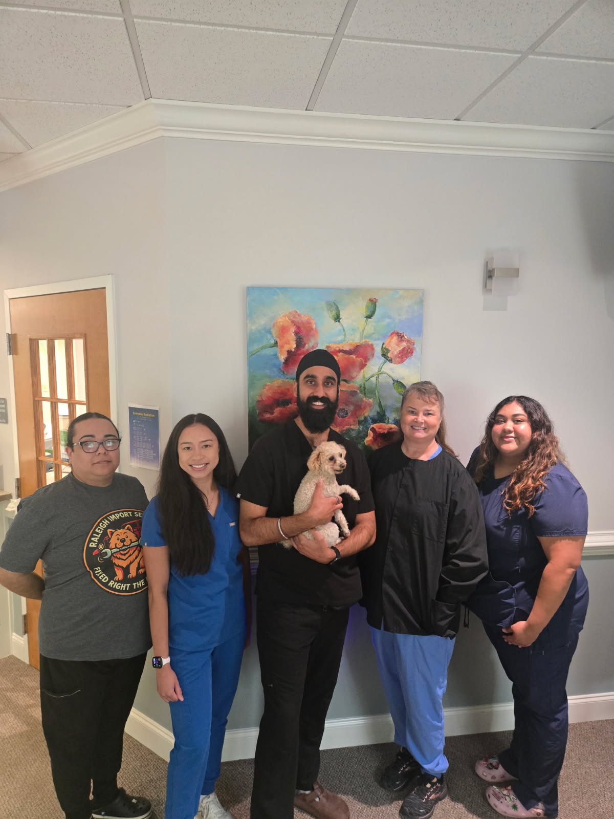 The North Oaks Family Dentistry team together in the office, including Dr. Grewal